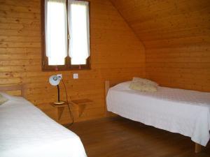 Postel nebo postele na pokoji v ubytování Lac des Graves