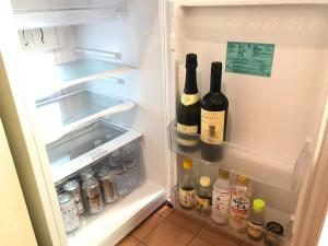 an open refrigerator with two bottles of wine at Marine House - Vacation STAY 77620v in Koshigoe