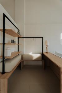 Voodi või voodid majutusasutuse Ponte Suites toas