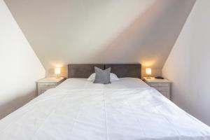 Postel nebo postele na pokoji v ubytování Roemser Stuebchen