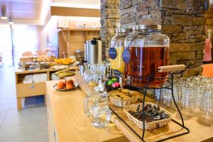 a bar with a drink mixer on a counter at Hotel Jirinka in Dolní Morava