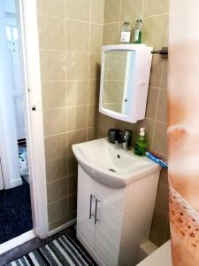 a bathroom with a sink and a mirror at The Quiet Room in Newcastle upon Tyne