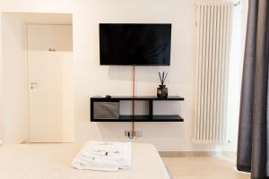 TV a/nebo společenská místnost v ubytování Bed and Breakfast Le Foglie