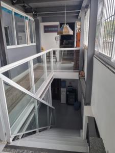 an overhead view of a staircase in a house at Quarto duplo em Bacaxa in Saquarema