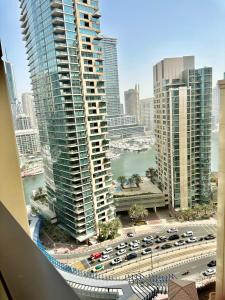 a view of a city with tall buildings and traffic at 2BR Luxury Apartment Marina View in Dubai