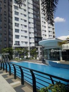 a swimming pool in a city with tall buildings at Sky Chalet at Axis Next To LRT Pandan Indah Ampang in Ampang