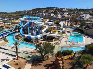 an aerial view of a water park with a water slide at Splendid Seaside Retreat on Spinola Bay in St. Julianʼs