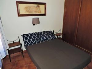 Posteľ alebo postele v izbe v ubytovaní APARTAMENTOS CASERIA DE COMARES