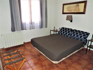 Posteľ alebo postele v izbe v ubytovaní APARTAMENTOS CASERIA DE COMARES