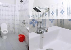 a bathroom with a sink and a toilet at Noor Plaza in Angamali +50 photos