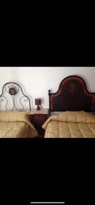Кровать или кровати в номере Gran sasso white