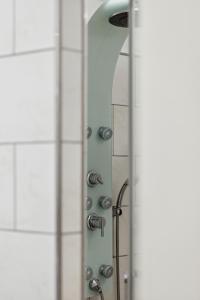 a bathroom with a shower with a shower head at Ferienwohnungen Deidesheim in Deidesheim