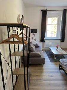 a living room with a bunk bed and a couch at Apartment 4 - Haus Lausitzring in Annahütte