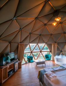 a room with a large window in a tent at Lusso Glamping Bodrum in Bodrum City