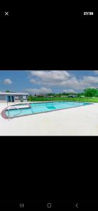 a picture of a large swimming pool with at Lake Fork Fishing Getaway in Quitman