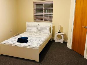 Säng eller sängar i ett rum på Prime Inn homes