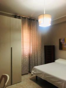 Cama ou camas em um quarto em Camere Villa Lella