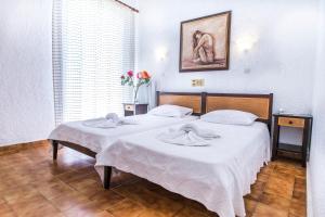 Кровать или кровати в номере Creta Aquamarine Hotel