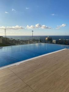 a large swimming pool on top of a building at Casa Arirni in Las Palmas de Gran Canaria