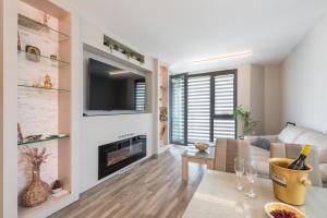 a living room with a couch and a fireplace at Apartment A - Lifestyle Holiday in St. St. Constantine and Helena