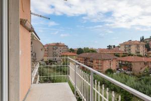 a balcony with a view of a city at H11 [Casa Mare Smeraldo] Parcheggio in San Lorenzo al Mare