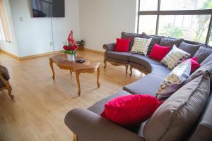 a living room with couches and a coffee table at Sojourners' Rest House in Germiston