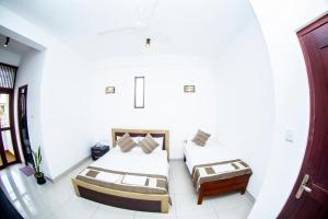 Postel nebo postele na pokoji v ubytování Hotel Blue Bird