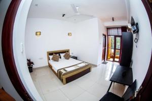 Postel nebo postele na pokoji v ubytování Hotel Blue Bird