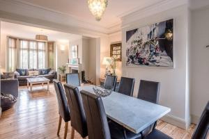 a dining room with a table and chairs at 6 The Terrace, Walberswick in Southwold