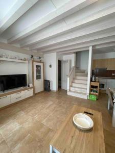 a large living room with a table and a couch at Casa en la montaña con piscina de temporada in Arredondo +34 photos