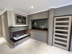 a living room with a fireplace and a mirror at Apartamentos Bella Vista in Bella Vista +83 photos