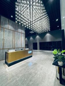 a large room with a lobby with a reception desk at TRION KL by JRLodge Homestay in Kuala Lumpur