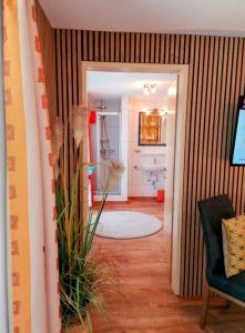 a hallway of a bathroom with a sink and a toilet at Gästehaus Judith in Längenfeld