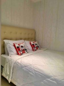 Postel nebo postele na pokoji v ubytování FX Sudirman 28 + 18 fotografií
