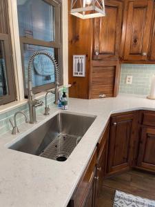 a kitchen with a sink in a kitchen at Cozy 4br Lake Lanier GA Waterfront- Great Location in Gainesville