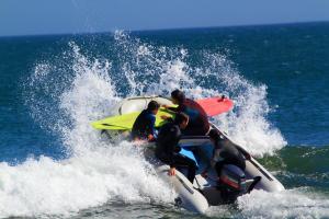 a group of people on a boat in the ocean at Delfines de Chicama Hotel in Puerto Chicama