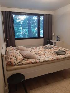 Postel nebo postele na pokoji v ubytování Siltamäen Helmi/1-5 per/parking/10 min airport