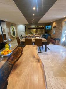 a room with a table with a cutting board on the floor at Les Hauts Complex in Coulaures
