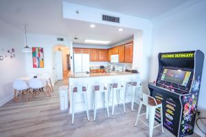 a kitchen with a video game in a room at Orlando Blue Heron Beach Resort Renewed apartment in Orlando