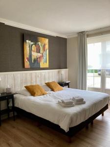 Giường trong phòng chung tại B&B Castellier