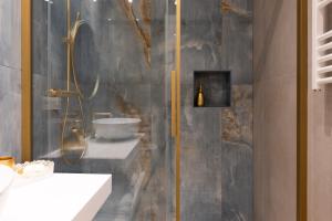 a bathroom with a shower and a sink at RomeInSuite in Rome +29 photos