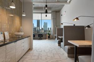 a salon with a view of a city skyline at NEW apts near Union Park w full amenities - Cloud9-1044 in Chicago