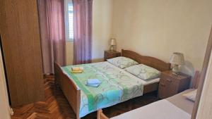 Ένα ή περισσότερα κρεβάτια σε δωμάτιο στο Adriatic Retreat: Apartmani Pazanin