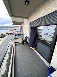 a balcony of a building with a view of a street at Alma's appartament in Sarandë