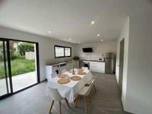 a kitchen with a table with cookies on it at Maison moderne in Is-sur-Tille