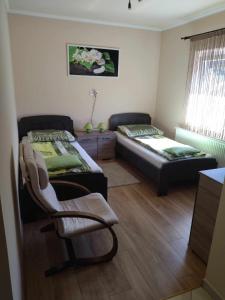 Posteľ alebo postele v izbe v ubytovaní Csaba apartman