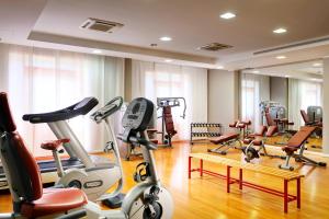 a gym with a bunch of exercise bikes in it at Four Points by Sheraton Siena in Siena