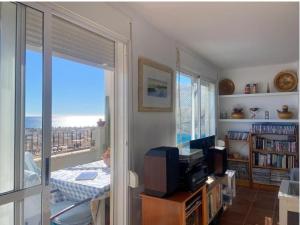 a living room with a view of the ocean at La caracola in Carboneras
