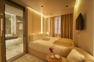 Letto o letti in una camera di Gold's Pyramids Hotel