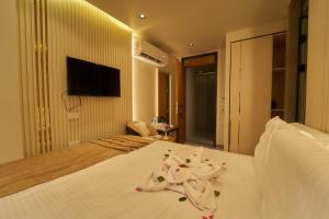 Letto o letti in una camera di Gold's Pyramids Hotel